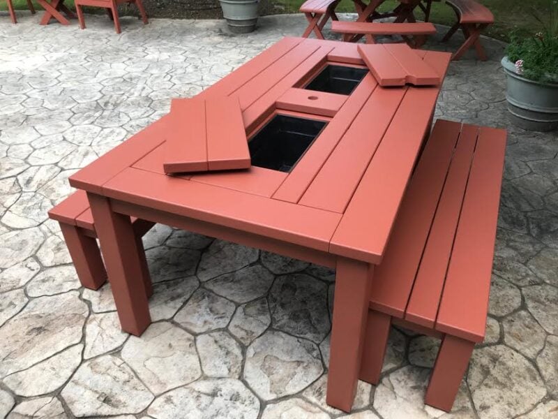 A "cooler" picnic table. This picnic table is complete with removable coolers for a fun gathering.